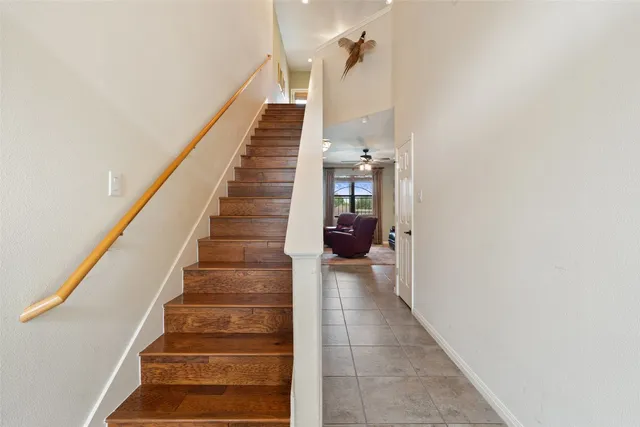 a view of staircase with white walls