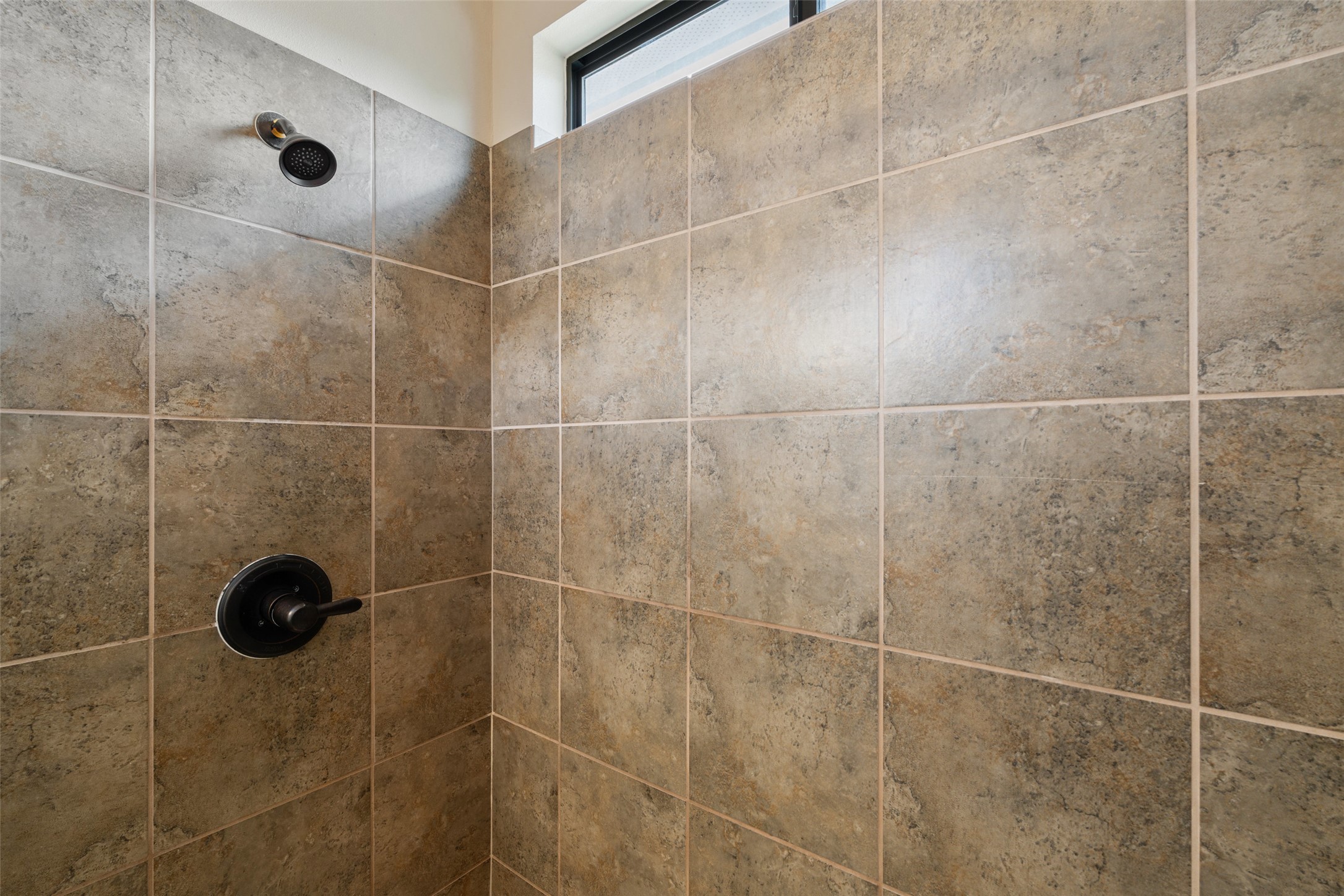 6006 Seville Drive Austin, TX 78724 - Photo 27 of 38 a bathroom with a shower