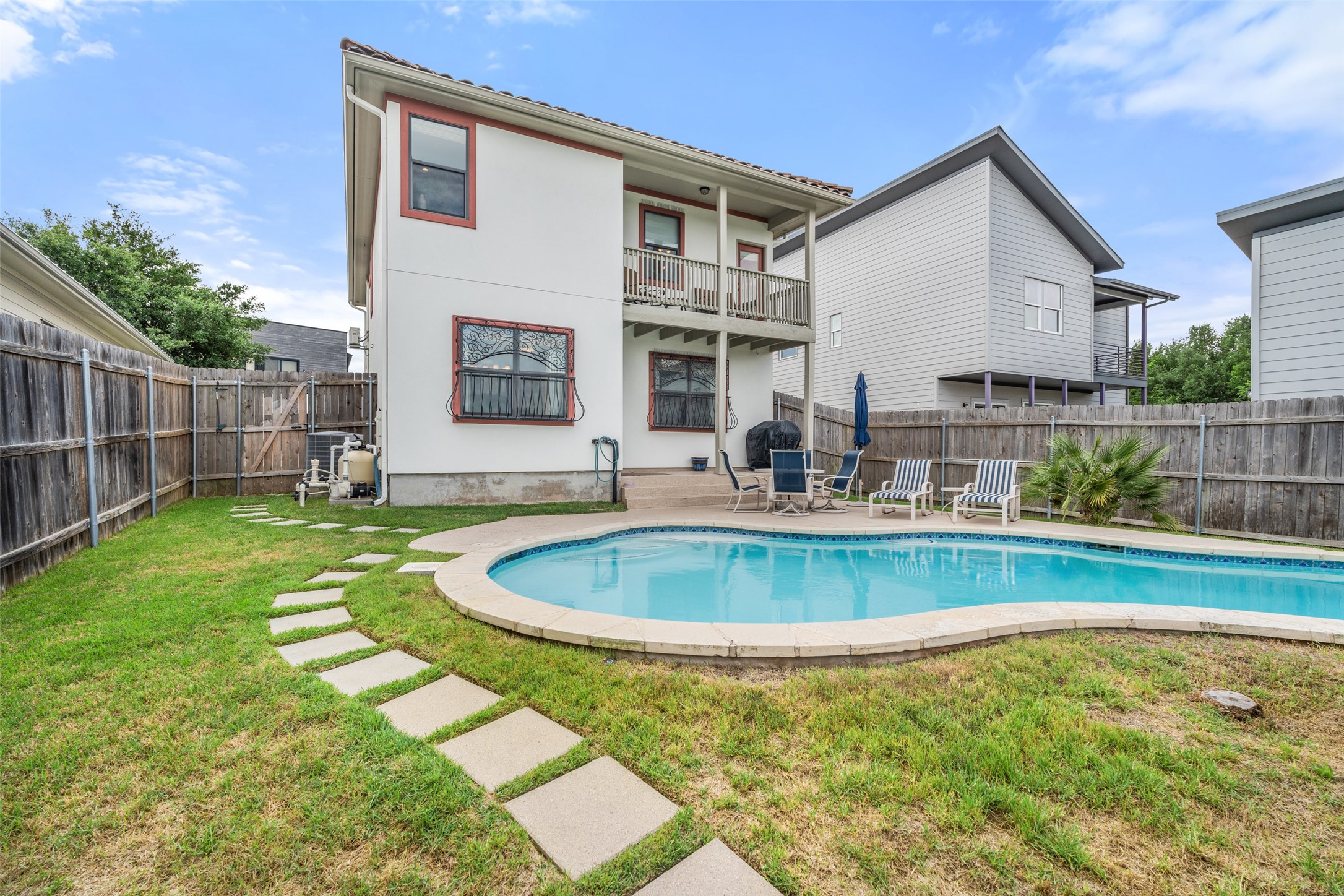 6006 Seville Drive Austin, TX 78724 - Photo 33 of 38 a swimming pool with outdoor seating and yard