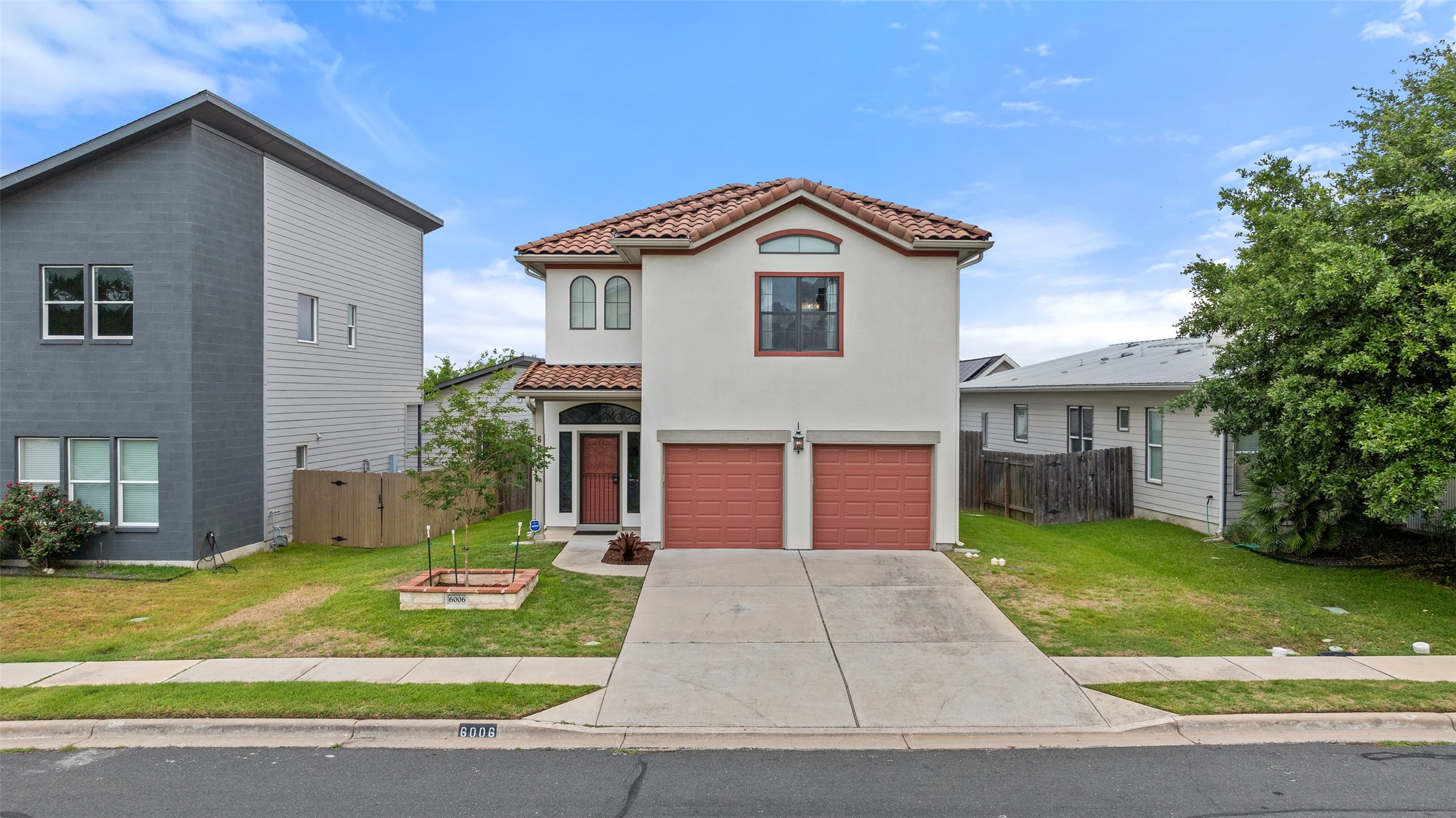 6006 Seville Drive Austin, TX 78724 - Photo 37 of 38 a front view of a house with a yard and garage