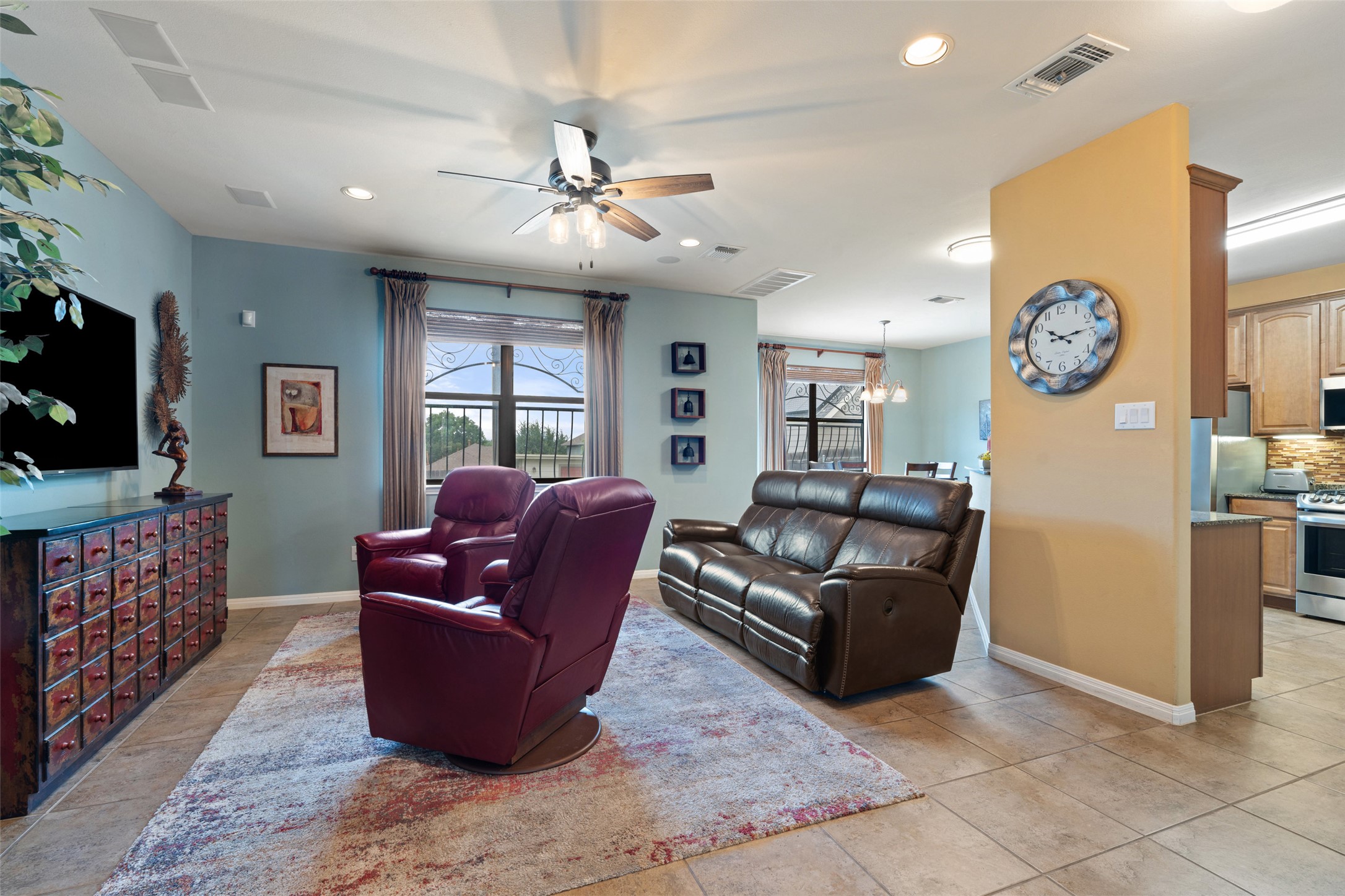6006 Seville Drive Austin, TX 78724 - Photo 9 of 38 a living room with furniture and a flat screen tv