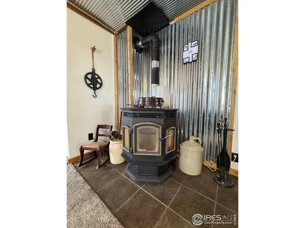 a view of a room with a table and chairs