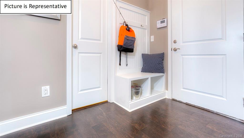 8007 Oakmere Road Waxhaw, NC 28173 - Photo 16 of 40 a view of a livingroom with wooden floor and furniture