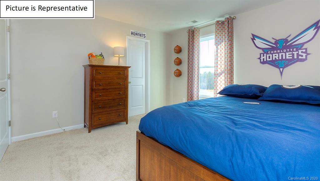 8007 Oakmere Road Waxhaw, NC 28173 - Photo 20 of 40 a bedroom with a bed and a closet