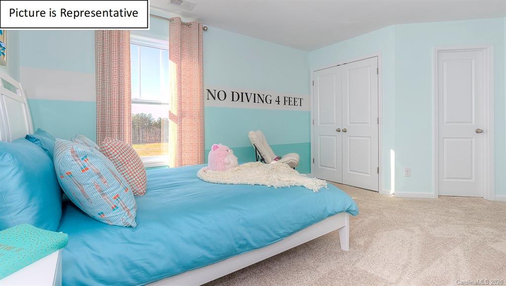 8007 Oakmere Road Waxhaw, NC 28173 - Photo 21 of 40 a bedroom with a bed and window