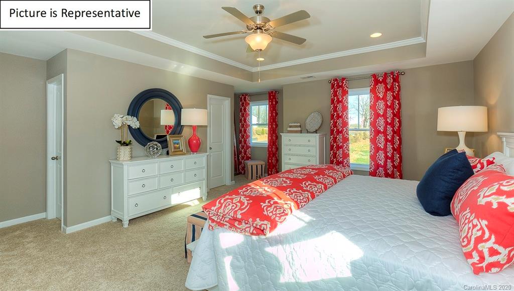 8007 Oakmere Road Waxhaw, NC 28173 - Photo 23 of 40 a bedroom with a bed and a dresser
