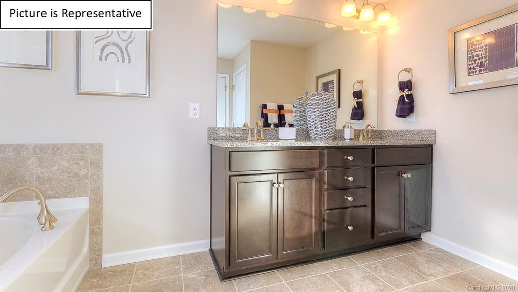 8007 Oakmere Road Waxhaw, NC 28173 - Photo 24 of 40 a room with a sink and cabinets