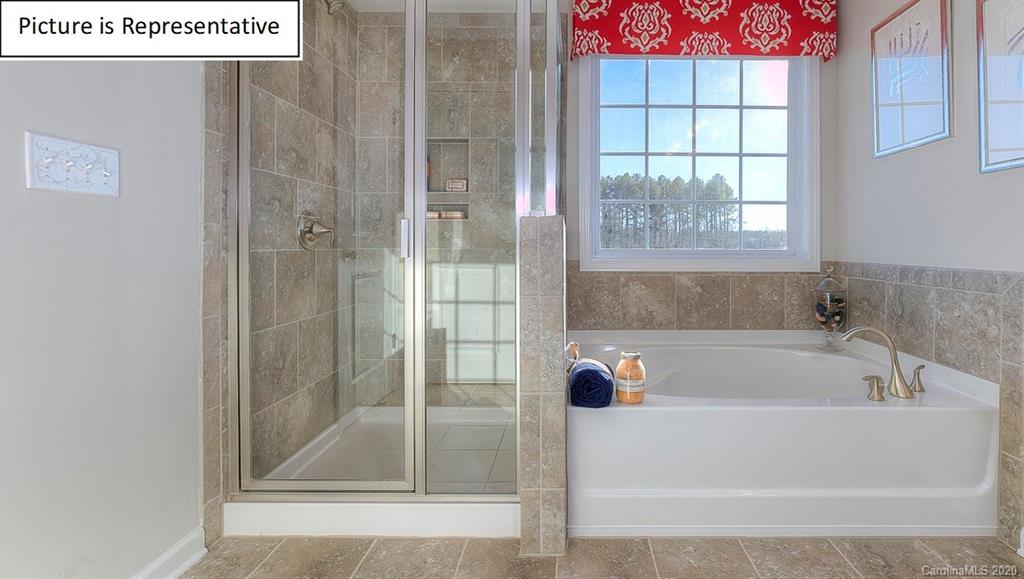 8007 Oakmere Road Waxhaw, NC 28173 - Photo 25 of 40 a white bath tub sitting next to a shower