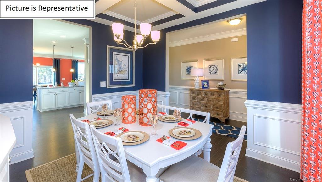 8007 Oakmere Road Waxhaw, NC 28173 - Photo 6 of 40 a view of a dining room with furniture and wooden floor