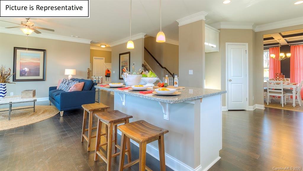 8007 Oakmere Road Waxhaw, NC 28173 - Photo 8 of 40 a living room with furniture and wooden floor
