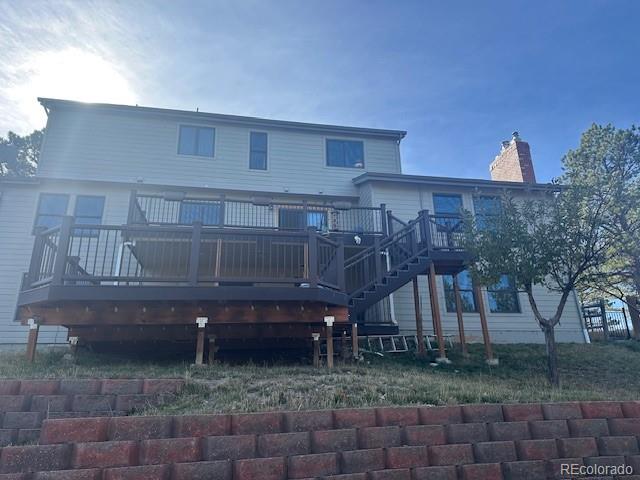 8865 Thunderbird Road Parker, CO 80134 - Photo 2 of 33 a view of a house with backyard and trees