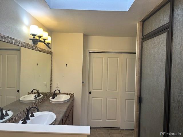 8865 Thunderbird Road Parker, CO 80134 - Photo 22 of 33 a bathroom with a sink and a mirror