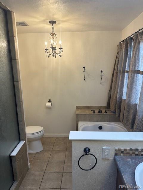 8865 Thunderbird Road Parker, CO 80134 - Photo 24 of 33 a bathroom with a sink a toilet and a mirror