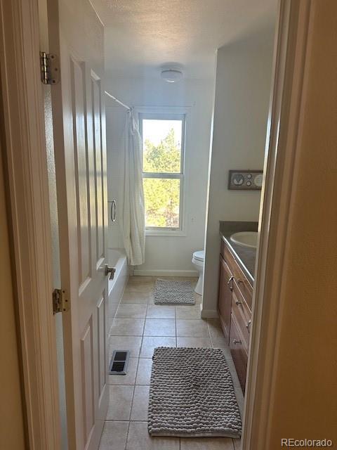 8865 Thunderbird Road Parker, CO 80134 - Photo 30 of 33 a bathroom with a sink a toilet a window and tub