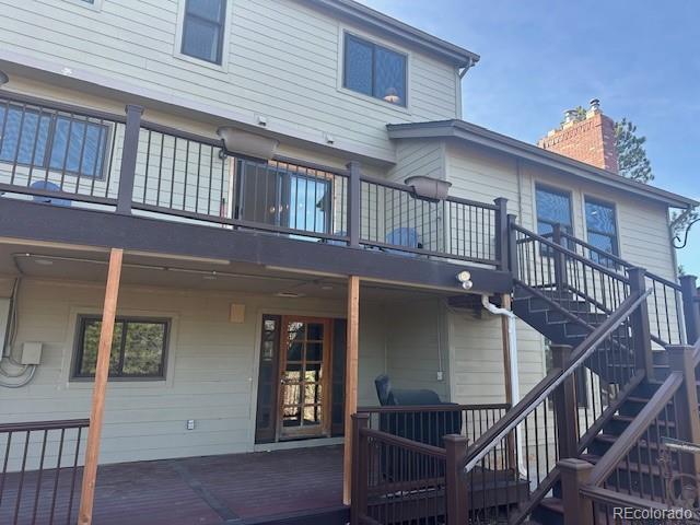 8865 Thunderbird Road Parker, CO 80134 - Photo 3 of 33 a view of a house with wooden stairs