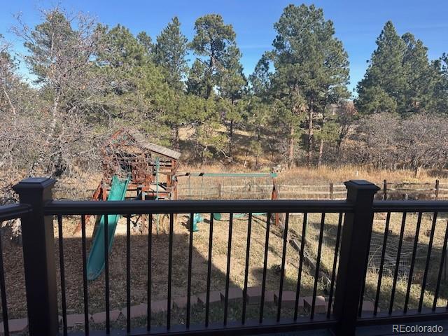 8865 Thunderbird Road Parker, CO 80134 - Photo 6 of 33 a view of a balcony with outdoor space