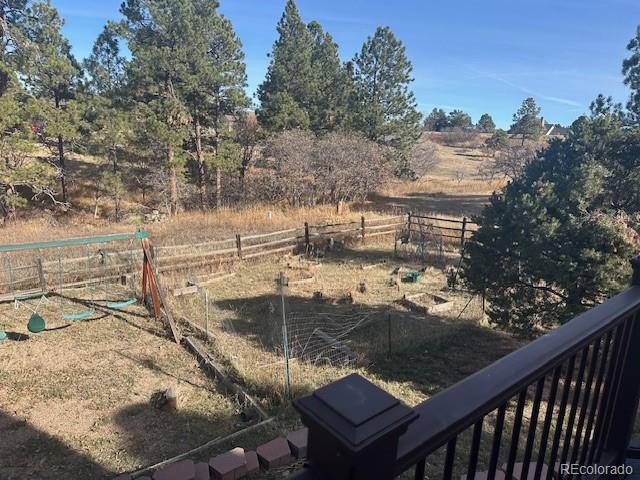 8865 Thunderbird Road Parker, CO 80134 - Photo 7 of 33 a view of a lake from a balcony