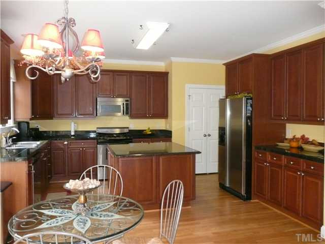 5224 Indigo Moon Way Raleigh, NC 27613 - Photo 9 of 25 Beautiful cabinets, granite, stainless steel appliances, and plenty of both storage and counter space. Kitchen