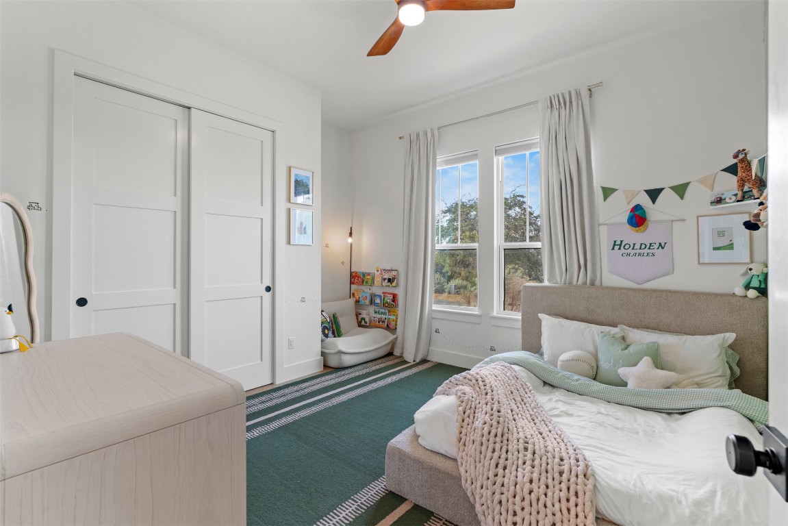 330 Kendall Road Spicewood, TX 78669 - Photo 12 of 32 a bedroom with a bed and a window