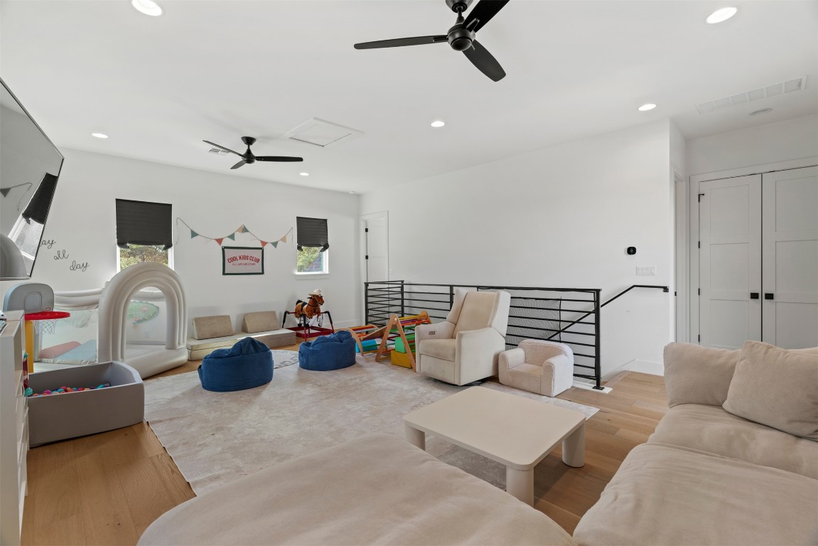 330 Kendall Road Spicewood, TX 78669 - Photo 16 of 32 a living room with furniture and a flat screen tv