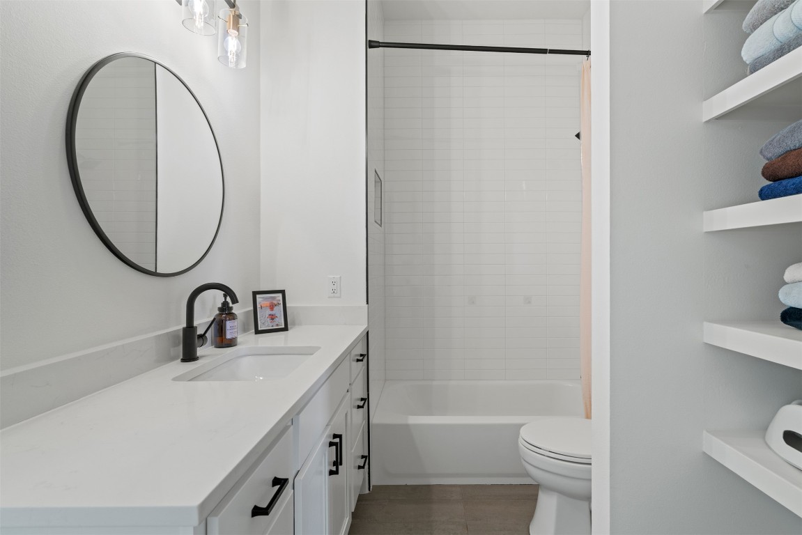 330 Kendall Road Spicewood, TX 78669 - Photo 20 of 32 a bathroom with a sink a toilet and a mirror