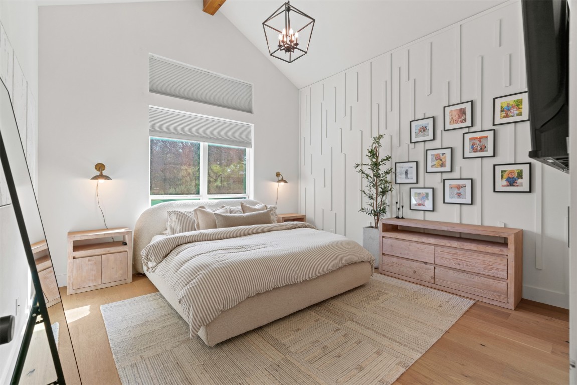 330 Kendall Road Spicewood, TX 78669 - Photo 8 of 32 a bedroom with a large bed and a window