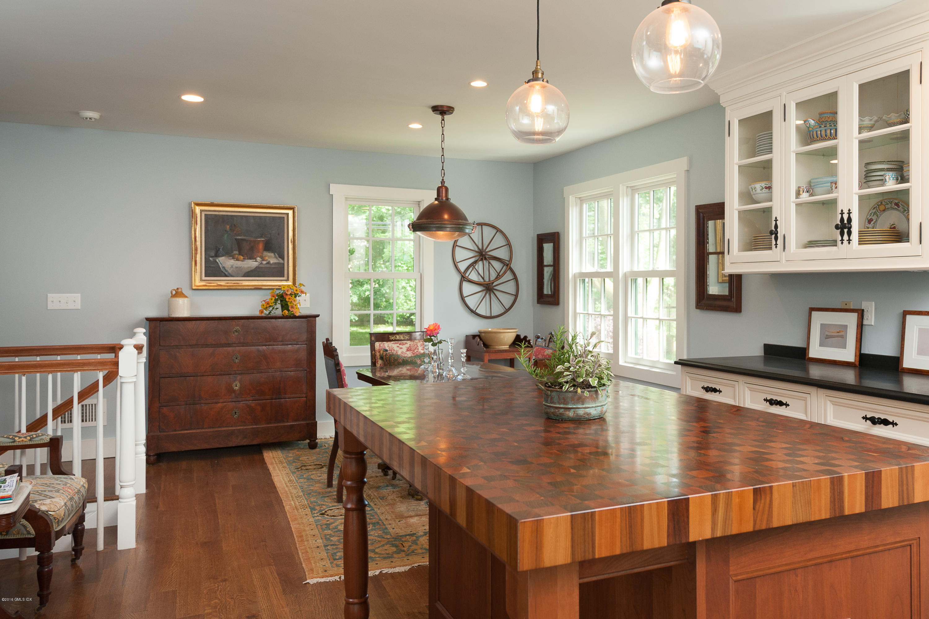 2 Cary Road Riverside, CT 06878 - Photo 11 of 24 a dining room with wooden floor and chandelier