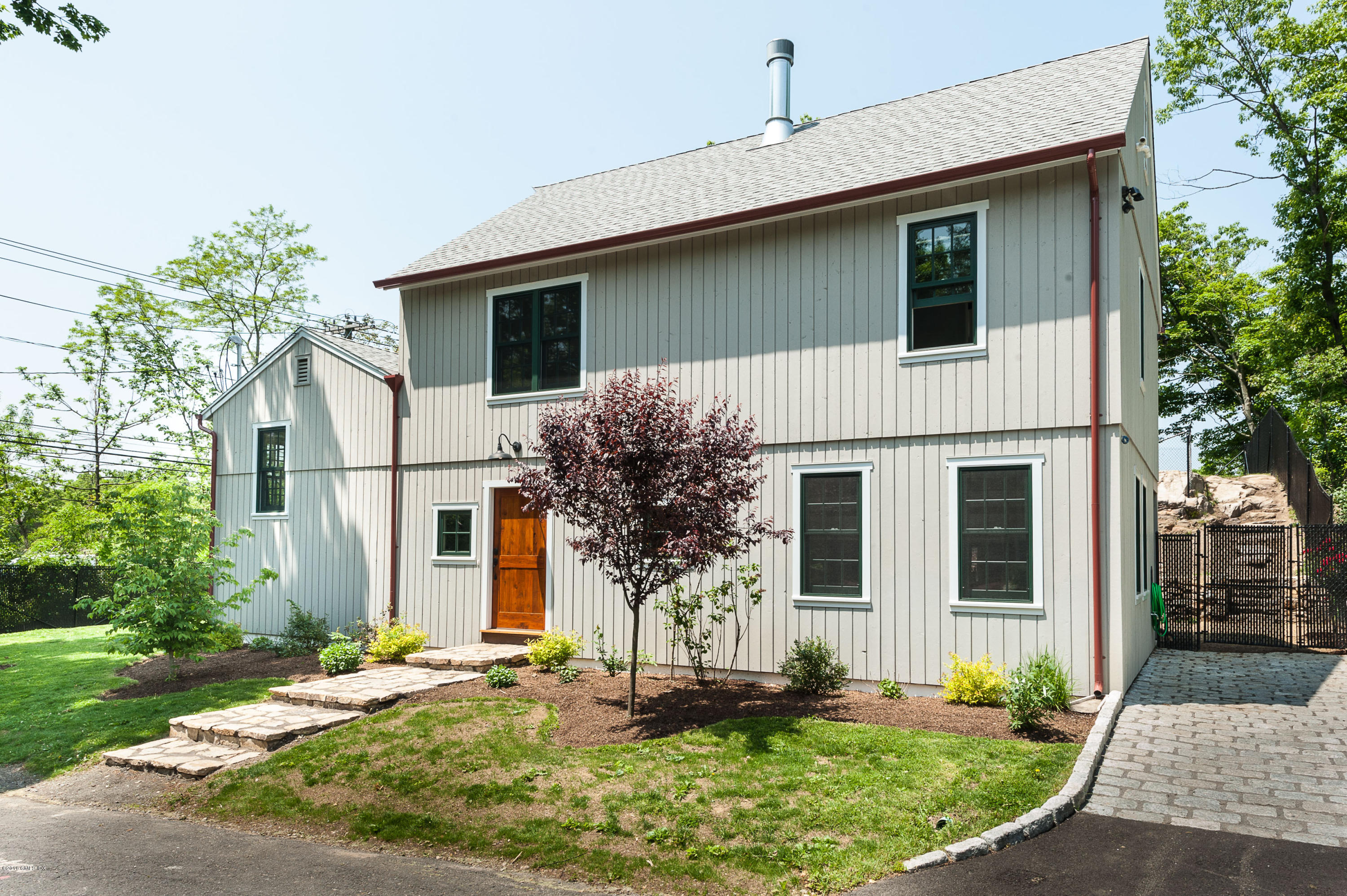 2 Cary Road Riverside, CT 06878 - Photo 24 of 24 a front view of a house with garden