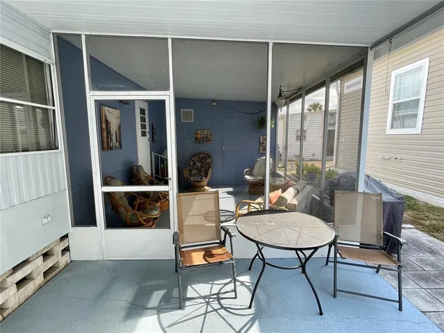 a balcony with furniture and rug