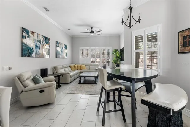 a kitchen with stainless steel appliances granite countertop a refrigerator a stove and a sink