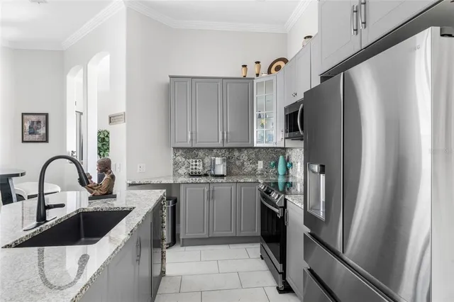 a bedroom with a bed and a television