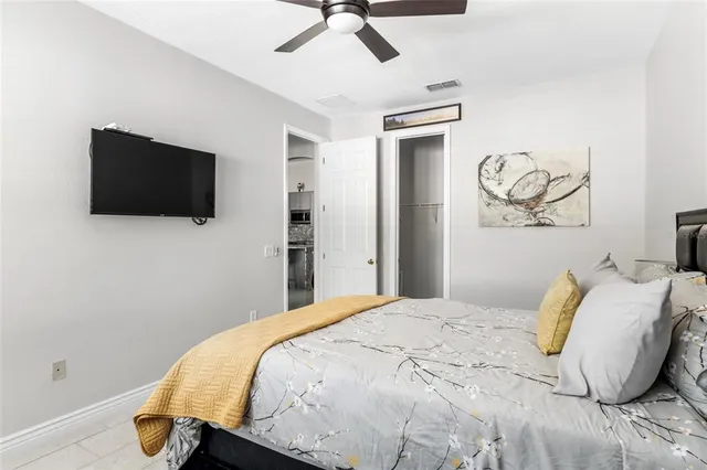 a bedroom with a bed and window