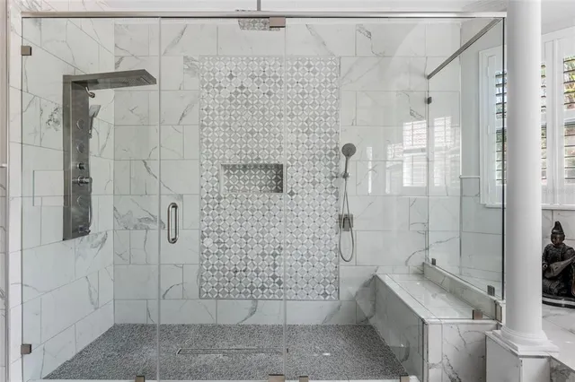 a view of a house with a yard and a pond