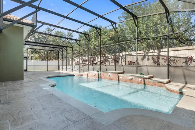 an aerial view of a house with a lake view