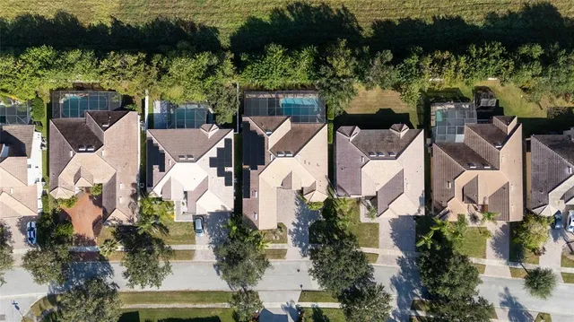 an aerial view of a house with lake view