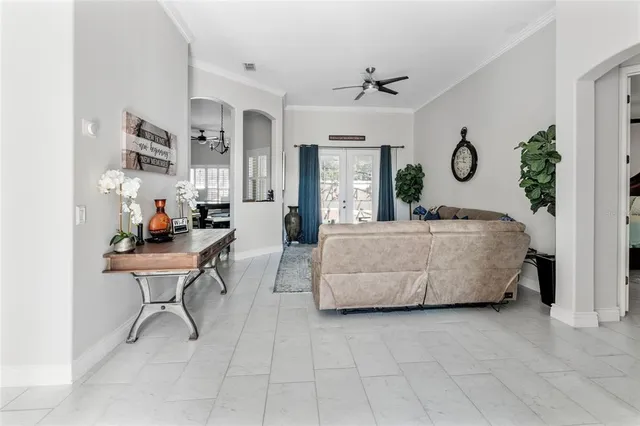 a living room with furniture wooden floor and window