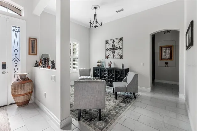 a view of living room filled with furniture and furniture