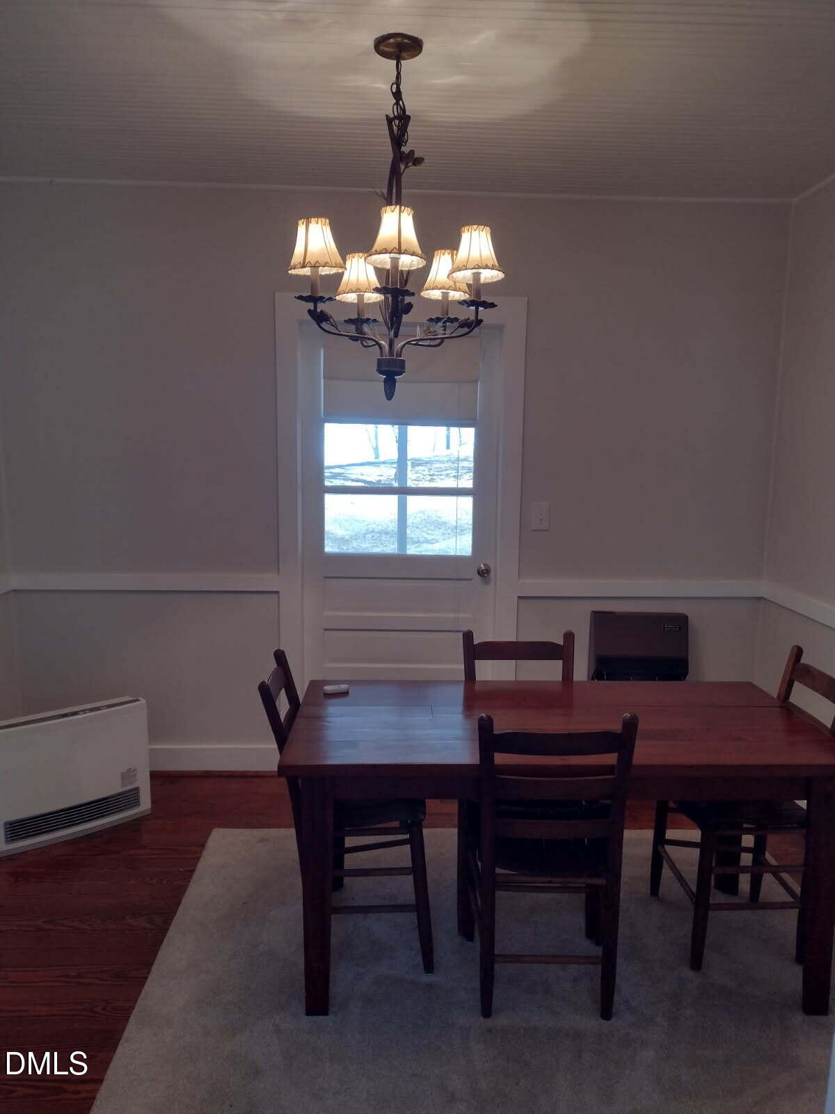 659 Chestnut Grove Road Spruce Pine, NC 28777 - Photo 11 of 21 a dining room with furniture a chandelier and window
