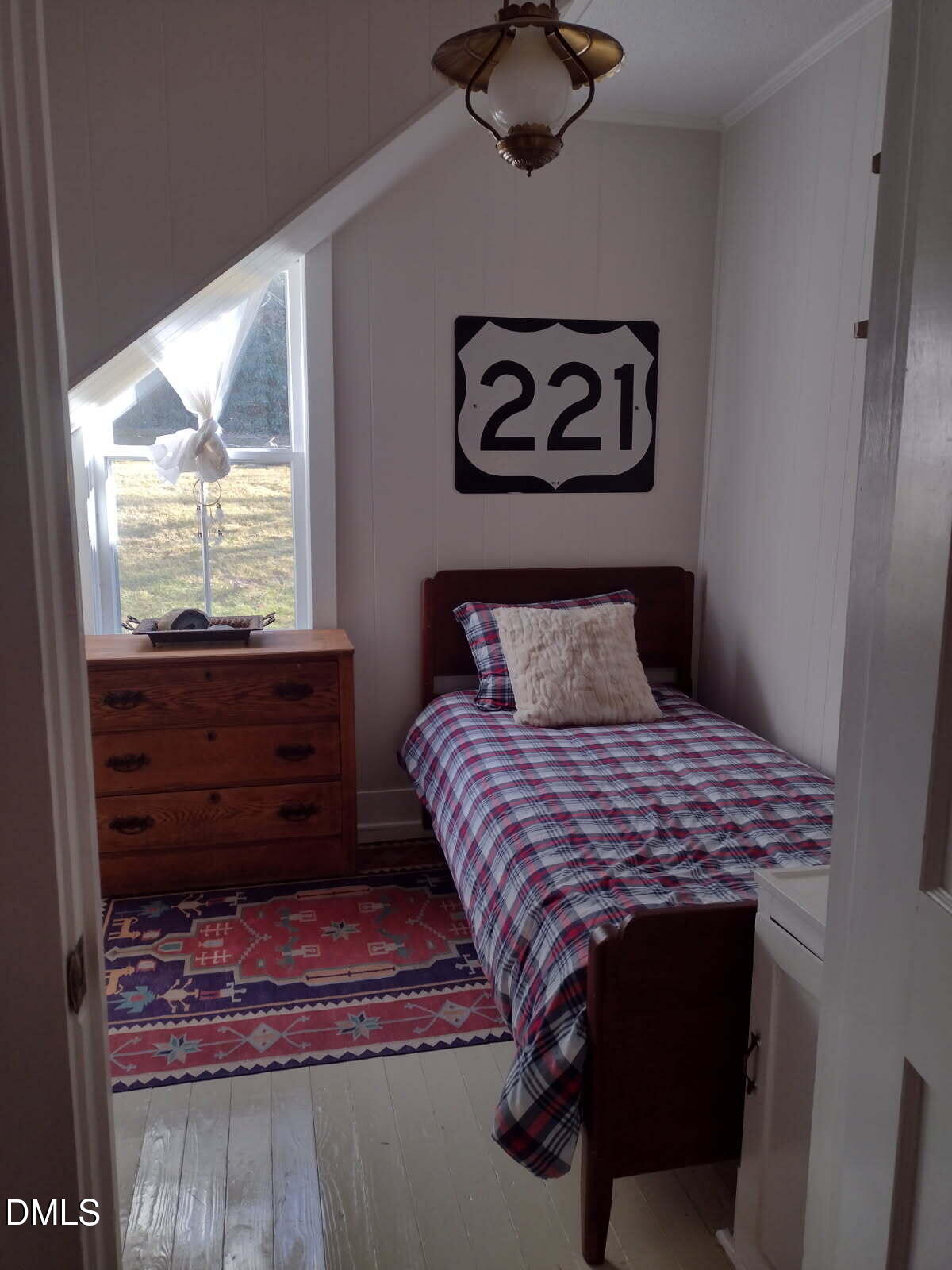659 Chestnut Grove Road Spruce Pine, NC 28777 - Photo 14 of 21 a bedroom with a bed and a window