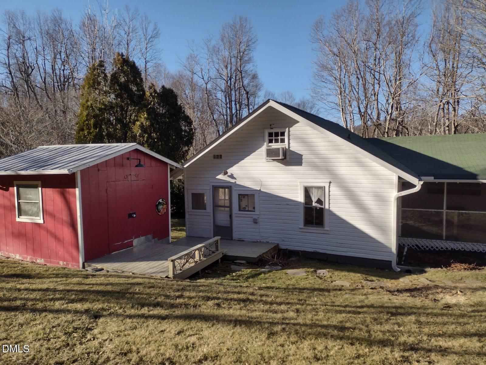 659 Chestnut Grove Road Spruce Pine, NC 28777 - Photo 3 of 21 a view of a house with a yard