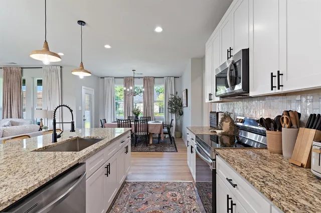 a kitchen with granite countertop lots of counter top space