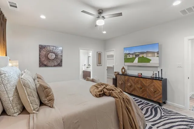 a bedroom with furniture and a bed