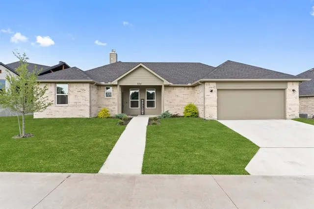 front view of a house and a yard