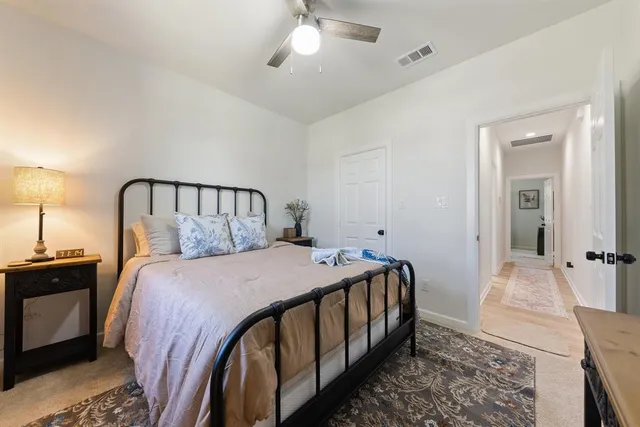 a bed room with a bed and a chandelier