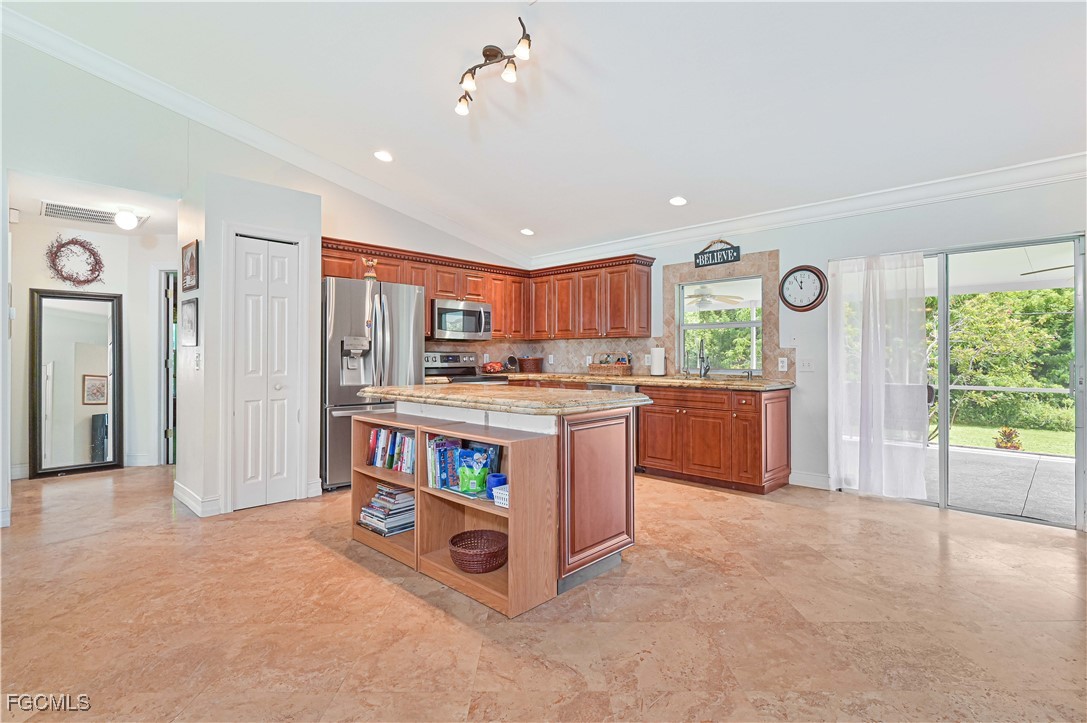 18217 Sycamore Road Fort Myers, FL 33967 - Photo 12 of 35 a kitchen with stainless steel appliances granite countertop a refrigerator and a sink