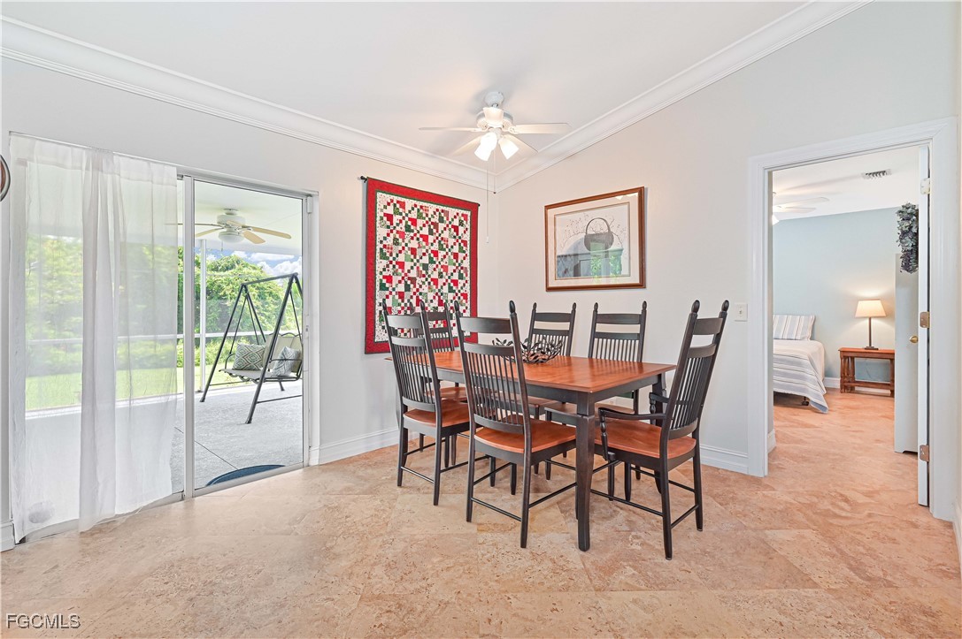 18217 Sycamore Road Fort Myers, FL 33967 - Photo 14 of 35 a view of a dining room with furniture window and outside view
