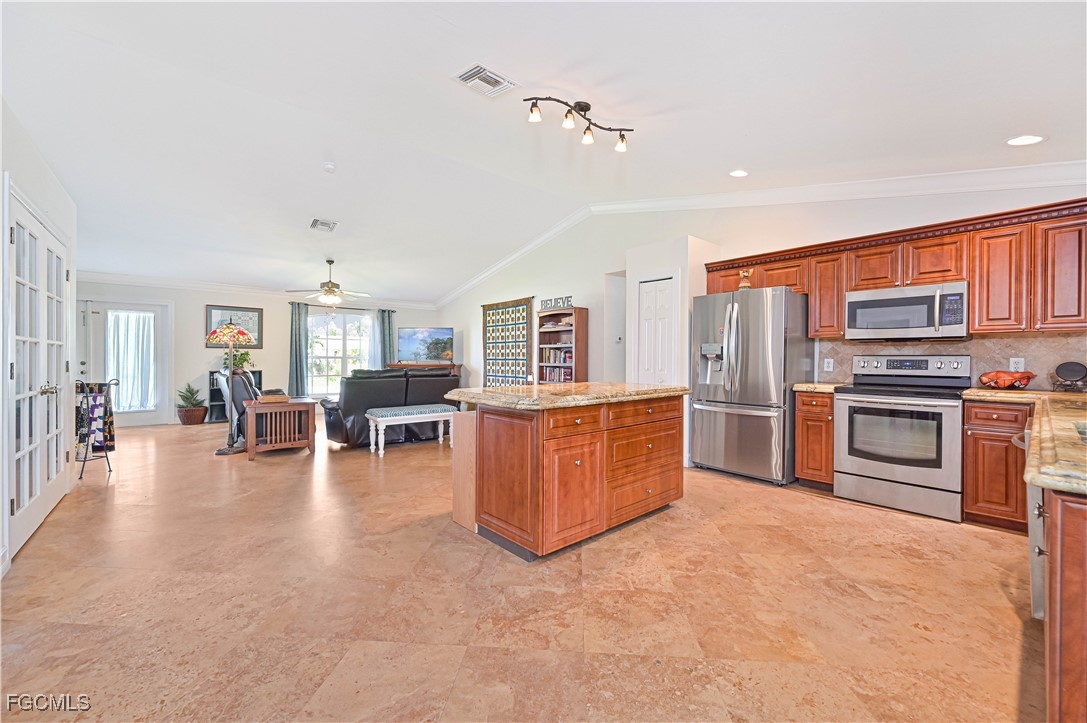 18217 Sycamore Road Fort Myers, FL 33967 - Photo 16 of 35 a living room with furniture and kitchen view