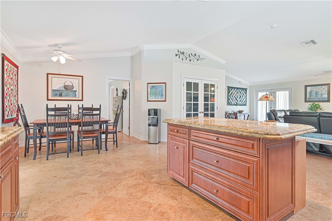 18217 Sycamore Road Fort Myers, FL 33967 - Photo 17 of 35 a room with furniture a dining table and a bookshelf
