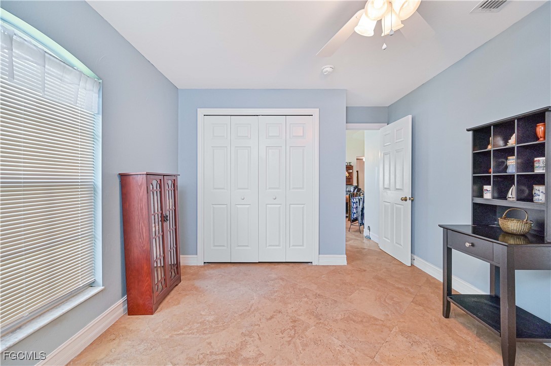 18217 Sycamore Road Fort Myers, FL 33967 - Photo 22 of 35 a view of a hallway with workspace and a window