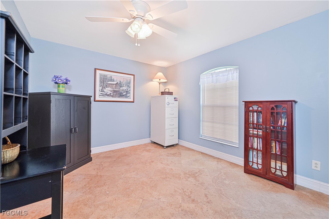 18217 Sycamore Road Fort Myers, FL 33967 - Photo 23 of 35 a view of a workspace with furniture and cabinet
